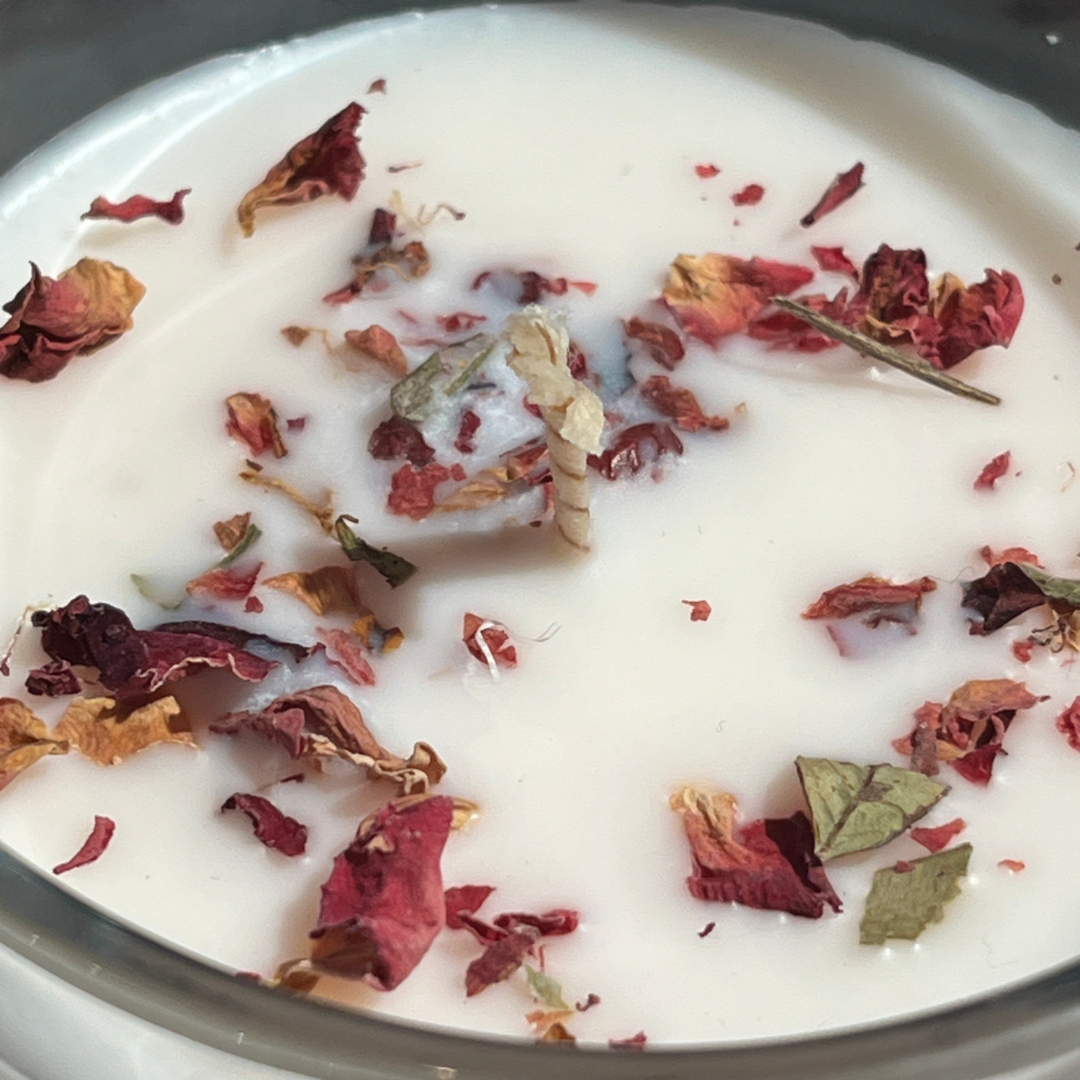 Close up of Rosy Charm candle wax with dried rose petals by Oud Library