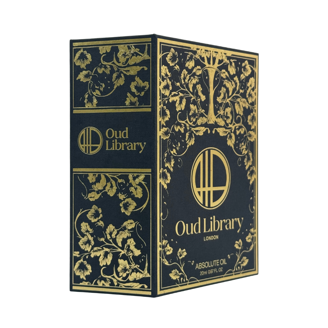 Pure oil perfume bottle next to its boxed packaging