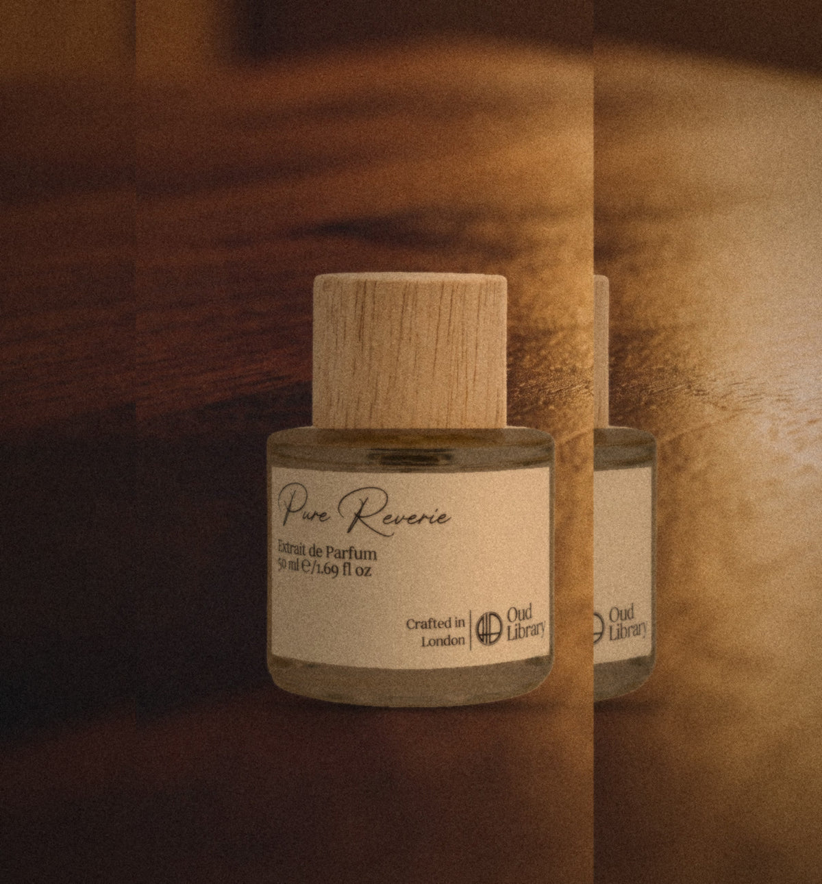Pure Reverie Extrait de Parfum, 50 ml, on a walnut table