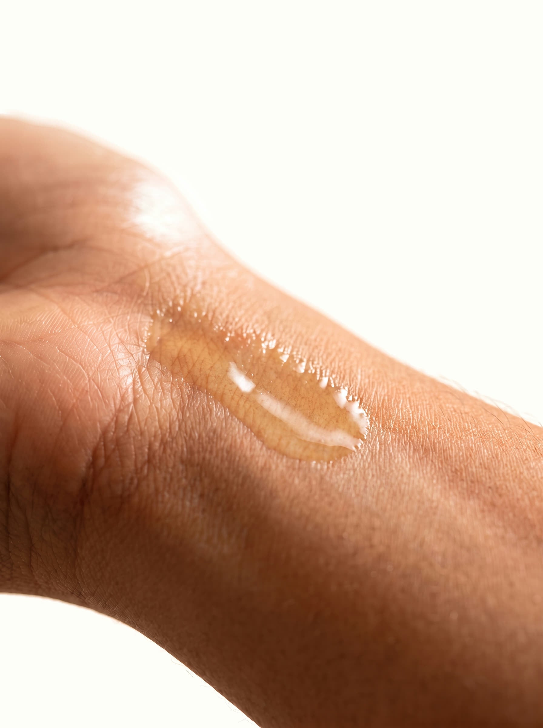 One or two drops of golden perfume oil, a small glossy dab on the inner wrist.